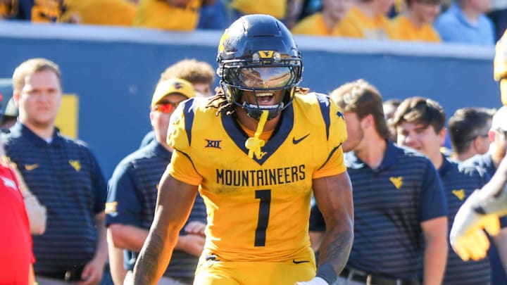 Aug 30, 2025; Morgantown, West Virginia, USA; West Virginia Mountaineers running back Jahiem White (1) celebrates with West Virginia Mountaineers running back Cyncir Bowers (23) after his touchdown run during the fourth quarter against the Robert Morris Colonials at Milan Puskar Stadium. Mandatory Credit: Ben Queen-Imagn Images Aug 30, 2025; Morgantown, West Virginia, USA; West Virginia Mountaineers running back Jahiem White (1) celebrates with West Virginia Mountaineers running back Cyncir Bowers (23) after his touchdown run during the fourth quarter against the Robert Morris Colonials at Milan Puskar Stadium. Mandatory Credit: Ben Queen-Imagn Images