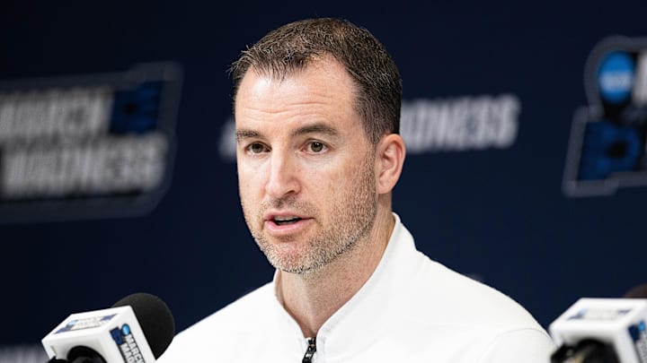 Mar 21, 2024; Indianapolis, IN, USA; Utah State Aggies head coach Danny Sprinkle talks to the media during the practice day at Gainbridge FieldHouse. Mandatory Credit: Trevor Ruszkowski-Imagn Images