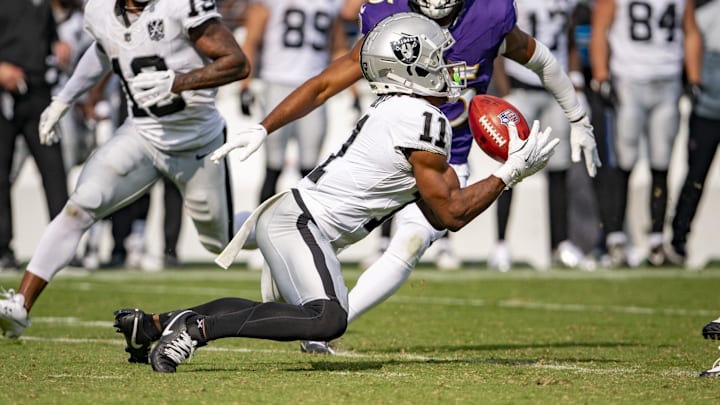 Sep 15, 2024; Baltimore, Maryland, USA;  Las Vegas Raiders wide receiver Tre Tucker (11) secures a kickoff during the second half against the Baltimore Ravens at M&T Bank Stadium. Mandatory Credit: Tommy Gilligan-Imagn Images