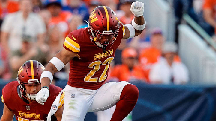 Sep 17, 2023; Denver, Colorado, USA; Denver Broncos quarterback Russell Wilson (3) slides for a first down against Washington Commanders safety Darrick Forrest (22) and linebacker Cody Barton (57) in the fourth quarter at Empower Field at Mile High. Mandatory Credit: Isaiah J. Downing-Imagn Images Sep 17, 2023; Denver, Colorado, USA; Denver Broncos quarterback Russell Wilson (3) slides for a first down against Washington Commanders safety Darrick Forrest (22) and linebacker Cody Barton (57) in the fourth quarter at Empower Field at Mile High. Mandatory Credit: Isaiah J. Downing-Imagn Images