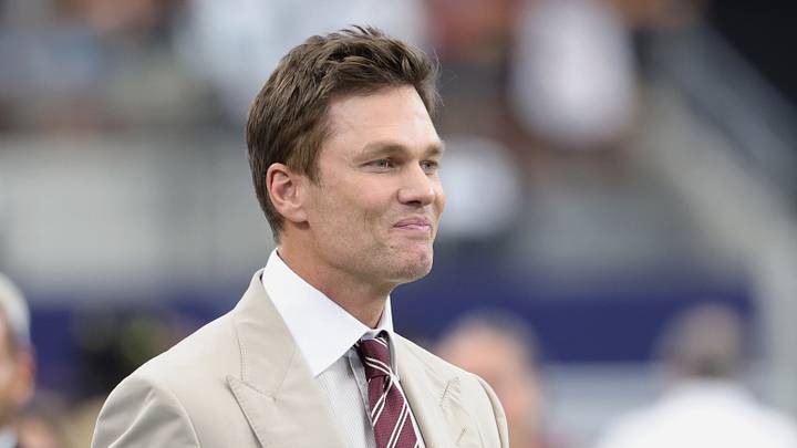 Fox Sports broadcast analyst Tom Brady walks on the field before a game between the Washington Commanders and the Dallas Cowboys. Fox Sports broadcast analyst Tom Brady walks on the field before a game between the Washington Commanders and the Dallas Cowboys.