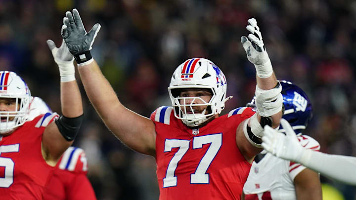 Dec 1, 2025; Foxborough, Massachusetts, USA; New England Patriots center Garrett Bradbury (65) and New England Patriots center Ben Brown (77) celebrate after a play during the second quarter against the New York Giants at Gillette Stadium. Mandatory Credit: David Butler II-Imagn Images