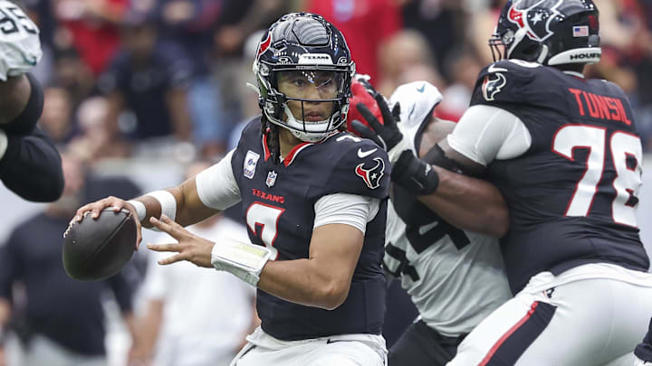 Sep 29, 2024; Houston, Texas, USA; Houston Texans quarterback C.J. Stroud (7) looks for an open receiver during the fourth quarter against the Jacksonville Jaguars at NRG Stadium. Mandatory Credit: Troy Taormina-Imagn Images