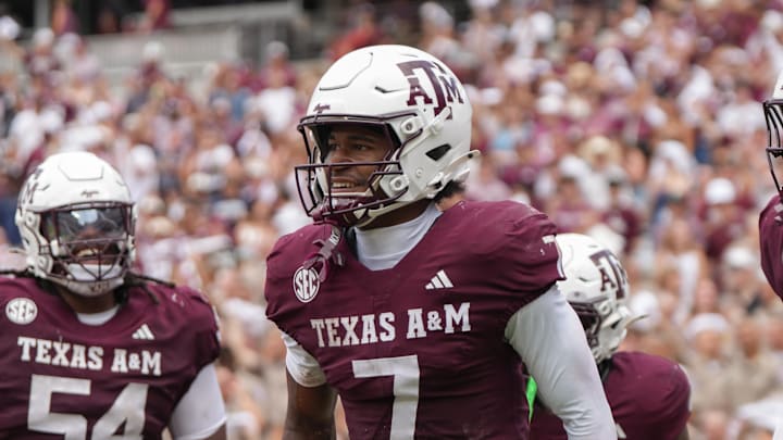 Sep 6, 2025; College Station, Texas, USA; Texas A&M Aggies offensive lineman Mark Nabou Jr. (54), Texas A&M Aggies wide receiver KC Concepcion (7) and Texas A&M Aggies tight end Theo Melin Öhrström (17) celebrate after a touchdown during the second half against the Utah State Aggies at Kyle Field. Mandatory Credit: Sean Thomas-Imagn Images