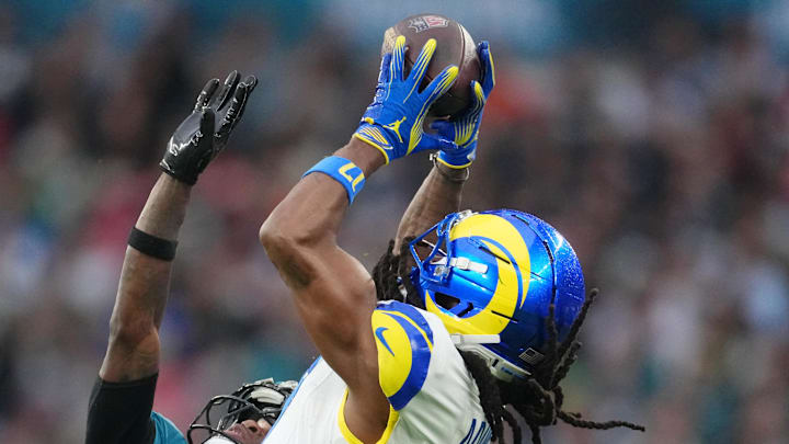 Oct 19, 2025; London, United Kingdom; Los Angeles Rams wide receiver Davante Adams (17) makes a catch against Jacksonville Jaguars wide receiver Travis Hunter (12) during the second half of an NFL International Series game at Wembley Stadium. Mandatory Credit: Kirby Lee-Imagn Images