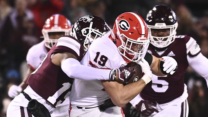 Georgia Bulldogs tight end Brock Bowers (19) runs the ball against Mississippi State Bulldogs safety Collin Duncan (19) during the first quarter at Davis Wade Stadium at Scott Field. 