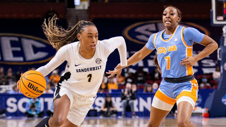 Mar 6, 2025; Greenville, SC, USA; Vanderbilt Commodores guard Mikayla Blakes (1) drives by Tennessee Lady Vols guard Samara Spencer (7) during the second half at Bon Secours Wellness Arena. Mandatory Credit: Scott Kinser-Imagn Image
