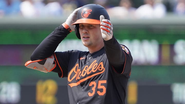 Aug 1, 2025; Chicago, Illinois, USA; Baltimore Orioles catcher Adley Rutschman (35) gestures after hitting a double against the Chicago Cubs during the ninth inning at Wrigley Field. Mandatory Credit: David Banks-Imagn Images