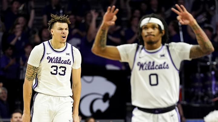 Dec 30, 2024; Manhattan, Kansas, USA; Kansas State Wildcats guard Coleman Hawkins (33) and guard Dug McDaniel (0) celebrate during the first half against the Cincinnati Bearcats at Bramlage Coliseum. Mandatory Credit: Jay Biggerstaff-Imagn Images