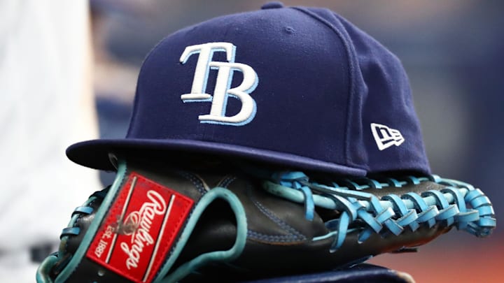 Sep 6, 2019; St. Petersburg, FL, USA; A detail view of a Tampa Bay Rays hat and glove at Tropicana Field.
