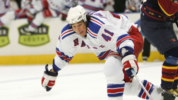 March 8, 2006; Atlanta, GA, USA; New York Rangers forward (41) Jed Ortmeyer reaches for a loose puck in front of Atlanta Thrashers (17) Ilya Kovalchuk and (44) Jaroslav Modry during second period action at Philips Arena.  The Thrashers won the game in a shootout 3-2. Mandatory Credit: Photo by Dale Zanine Imagn Images Copyright (c) 2006 Dale Zanine 