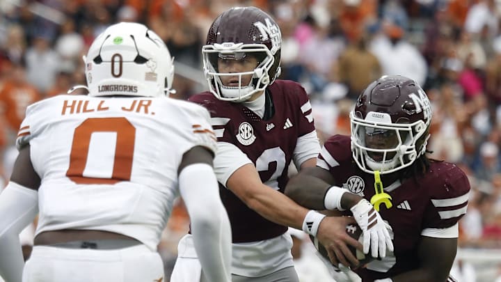 Mississippi State Bulldogs quarterback Blake Shapen (2) hands the ball off to running back Davon Booth (6) during the second quarter against the Texas Longhorns at Davis Wade Stadium at Scott Field. Mississippi State Bulldogs quarterback Blake Shapen (2) hands the ball off to running back Davon Booth (6) during the second quarter against the Texas Longhorns at Davis Wade Stadium at Scott Field.