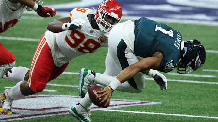 Feb 9, 2025; New Orleans, LA, USA; Philadelphia Eagles quarterback Jalen Hurts (1) is tackled by Kansas City Chiefs defensive tackle Tershawn Wharton (98) in the second quarter in Super Bowl LIX at Ceasars Superdome. Mandatory Credit: Stephen Lew-Imagn Images Feb 9, 2025; New Orleans, LA, USA; Philadelphia Eagles quarterback Jalen Hurts (1) is tackled by Kansas City Chiefs defensive tackle Tershawn Wharton (98) in the second quarter in Super Bowl LIX at Ceasars Superdome. Mandatory Credit: Stephen Lew-Imagn Images
