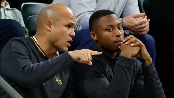 Jan 7, 2026; Waco, Texas, USA; DJ Lagway, a Florida quarterback currently in the transfer portal, sits with Baylor Bears football head coach Dave Aranda, left, during the first half of a game between the Baylor Bears and Iowa State Cyclones at Paul and Alejandra Foster Pavilion. Mandatory Credit: Chris Jones-Imagn Images Jan 7, 2026; Waco, Texas, USA; DJ Lagway, a Florida quarterback currently in the transfer portal, sits with Baylor Bears football head coach Dave Aranda, left, during the first half of a game between the Baylor Bears and Iowa State Cyclones at Paul and Alejandra Foster Pavilion. Mandatory Credit: Chris Jones-Imagn Images