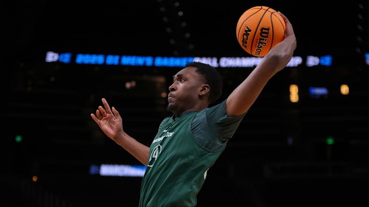 Mar 27, 2025; Atlanta, GA, USA; Michigan State Spartans forward Xavier Booker (34) dunks during NCAA Tournament South Regional Practice at State Farm Arena. Mandatory Credit: Brett Davis-Imagn Images