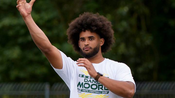 Dante Moore throws a pass during a youth football camp at Marist Catholic High School on June 20, 2026, in Eugene, Oregon. 
