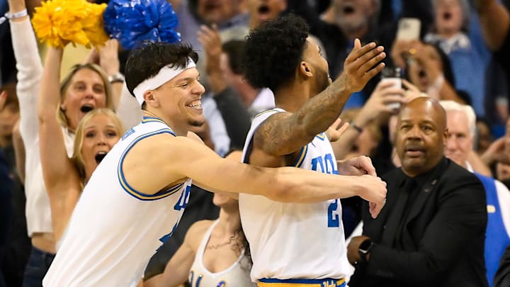 Feb 21, 2026; Los Angeles, California, USA; UCLA guard Donovan Dent (2) celebrates scoring the winning basket in overtime against the Illinois Fighting Illini at Pauley Pavilion presented by Wescom Financial. Mandatory Credit: Robert Hanashiro-Imagn Images Feb 21, 2026; Los Angeles, California, USA; UCLA guard Donovan Dent (2) celebrates scoring the winning basket in overtime against the Illinois Fighting Illini at Pauley Pavilion presented by Wescom Financial. Mandatory Credit: Robert Hanashiro-Imagn Images