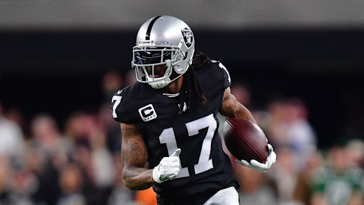 Las Vegas Raiders receiver Davante Adams runs with a ball.
