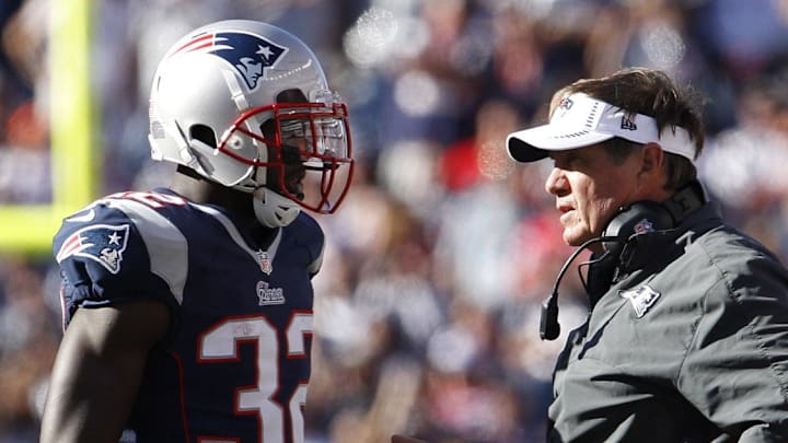 Sep 16, 2012; Foxborough, MA, USA; New England Patriots head coach Bill Belichick talks with cornerback Devin McCourty (32) and outside linebacker Jerod Mayo (51) as they take on the Arizona Cardinals during the second half at Gillette Stadium. The Arizona Cardinals defeated the New England Patriots 20-18. Mandatory Credit: David Butler II-Imagn Images