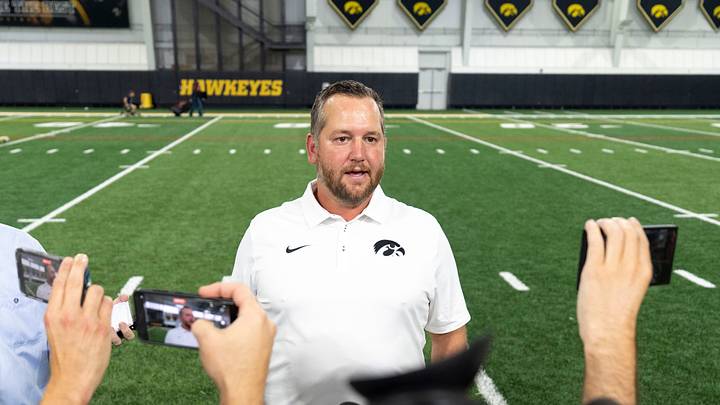 Iowa wide receivers coach Jon Budmayr talks to journalists Aug. 14, 2026 during the Iowa Football media day in Iowa City, Iowa.