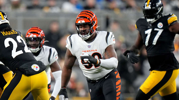 Cincinnati Bengals defensive tackle BJ Hill (92) chases Pittsburgh Steelers running back Najee Harris (22) in the first quarter during a Week 16 NFL football game between the Cincinnati Bengals and the Pittsburgh Steelersl, Saturday, Dec. 23, 2023, at Acrisure Stadium in Pittsburgh, Pa.