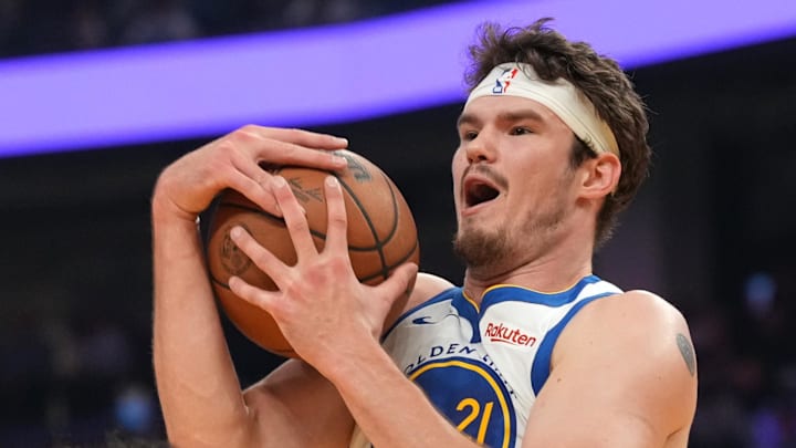 Mar 13, 2026; San Francisco, California, USA; Golden State Warriors center Quinten Post (21) holds onto a rebound against the Minnesota Timberwolves in the first quarter at the Chase Center. Mandatory Credit: Cary Edmondson-Imagn Images