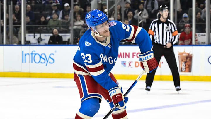Nov 16, 2025; New York, New York, USA; New York Rangers defenseman Adam Fox (23) looks to pass the puck against the Detroit Red Wings during the first period at Madison Square Garden. Mandatory Credit: John Jones-Imagn Images