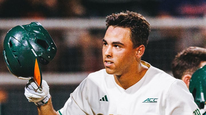 Miami Hurricanes third baseman Daniel Cuvet launches a ball out of the park for a home run against Notre Dame.