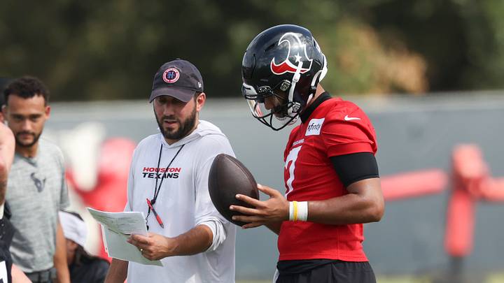 Houston Texans offensive coordinator Nick Caley talks with quarterback C.J. Stroud (7) Houston Texans offensive coordinator Nick Caley talks with quarterback C.J. Stroud (7)