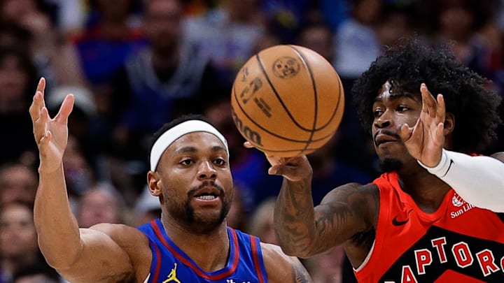 Toronto Raptors guard Jamal Shead passes the ball as Denver Nuggets guard Bruce Brown. Toronto Raptors guard Jamal Shead passes the ball as Denver Nuggets guard Bruce Brown.