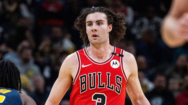 Mar 2, 2025; Indianapolis, Indiana, USA; Chicago Bulls guard Josh Giddey (3) dribbles the ball while Indiana Pacers forward Aaron Nesmith (23) defends in the first half at Gainbridge Fieldhouse. Mandatory Credit: Trevor Ruszkowski-Imagn Images
