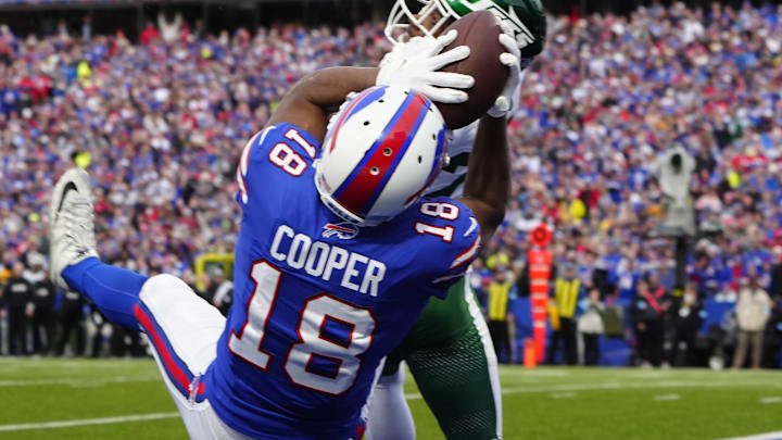 Dec 29, 2024; Orchard Park, New York, USA; Buffalo Bills wide receiver Amari Cooper (18) makes a catch for a touchdown against New York Jets cornerback Brandin Echols (26) during the second half at Highmark Stadium. Mandatory Credit: Gregory Fisher-Imagn Images Dec 29, 2024; Orchard Park, New York, USA; Buffalo Bills wide receiver Amari Cooper (18) makes a catch for a touchdown against New York Jets cornerback Brandin Echols (26) during the second half at Highmark Stadium. Mandatory Credit: Gregory Fisher-Imagn Images