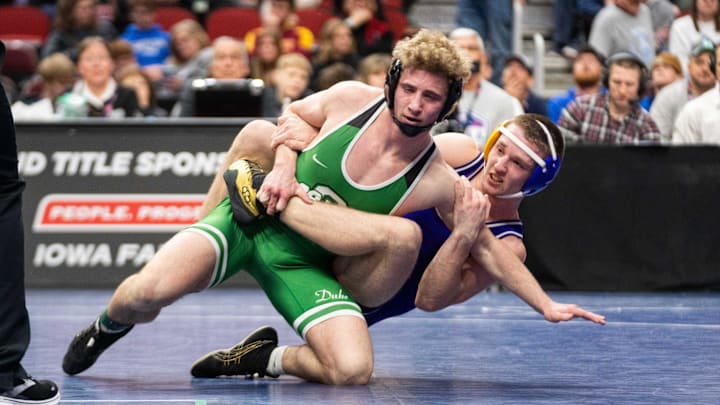 Osage's Blake Fox wrestles Lake Mills' Steve Brandenburg at 144 lbs during the Class 1A state wrestling final on Saturday, Feb. 22, 2025, at Wells Fargo Arena in Des Moines.