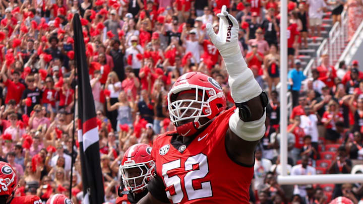 Georgia Bulldogs defensive lineman Christen Miller (52) runs on the field before a game against the Austin Peay Governors. Georgia Bulldogs defensive lineman Christen Miller (52) runs on the field before a game against the Austin Peay Governors.