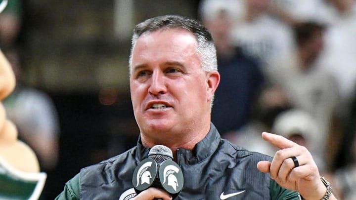Michigan State's new football coach Pat Fitzgerald addresses the crowd during a timeout in the first half of the Spartans basketball game against Iowa on Tuesday, Dec. 2, 2025, at the Breslin Center in East Lansing.