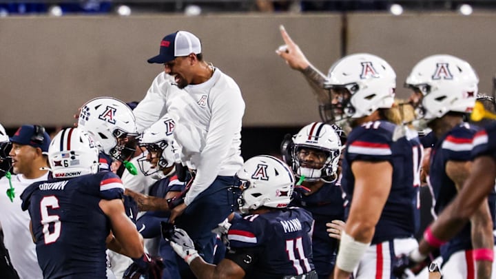 Oct 11, 2025; Tucson, Arizona, USA; Arizona Wildcats defensive back Dalton Johnson (43) celebrates an interception he caught from the Brigham Young Cougars with his team during the third quarter of the game at Arizona Stadium. Mandatory Credit: Aryanna Frank-Imagn Images Oct 11, 2025; Tucson, Arizona, USA; Arizona Wildcats defensive back Dalton Johnson (43) celebrates an interception he caught from the Brigham Young Cougars with his team during the third quarter of the game at Arizona Stadium. Mandatory Credit: Aryanna Frank-Imagn Images