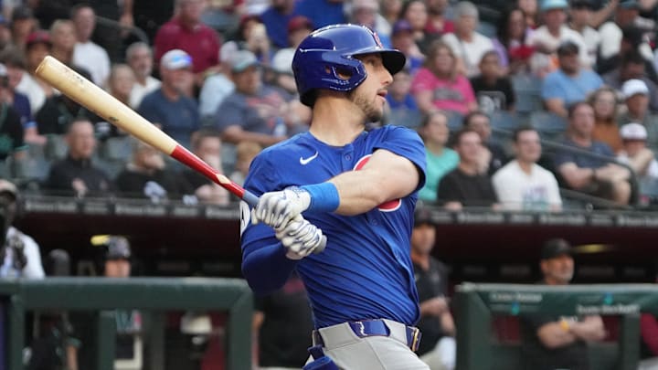 Mar 29, 2025; Phoenix, Arizona, USA; Chicago Cubs outfielder Kyle Tucker (30) hits a double against the Arizona Diamondbacks in the first inning at Chase Field.