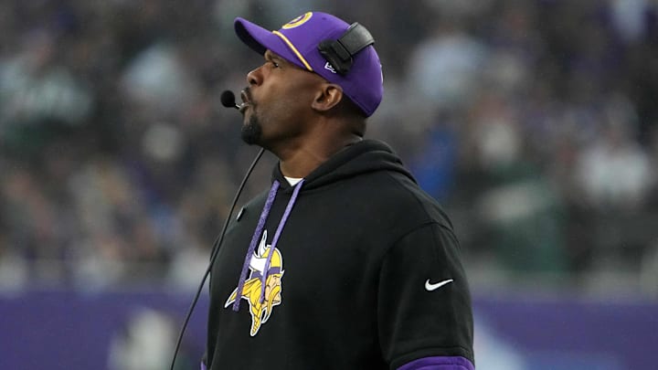 Oct 6, 2024; London, United Kingdom; Minnesota Vikings defensive coordinator Brian Flores watches from the sidelines against the New York Jets in the second half at Tottenham Hotspur Stadium. Mandatory Credit: Kirby Lee-Imagn Images