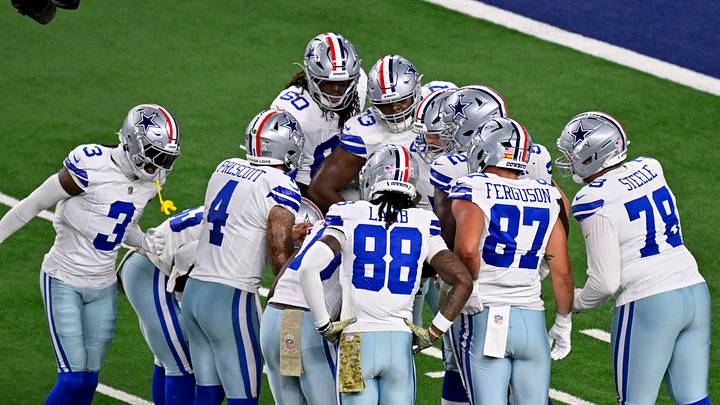 Dallas Cowboys quarterback Dak Prescott huddles with the offense during a game against the Arizona Cardinals at AT&T Stadium. Dallas Cowboys quarterback Dak Prescott huddles with the offense during a game against the Arizona Cardinals at AT&T Stadium.