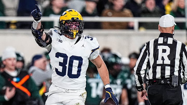 Michigan linebacker Jimmy Rolder (30) celebrates a Michigan State turnover during the first half at Spartan Stadium 