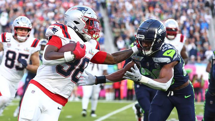 Feb 8, 2026; Santa Clara, CA, USA; New England Patriots running back Rhamondre Stevenson (38) runs against Seattle Seahawks cornerback Josh Jobe (29) during the second quarter in Super Bowl LX at Levi's Stadium. Mandatory Credit: Mark J. Rebilas-Imagn Images