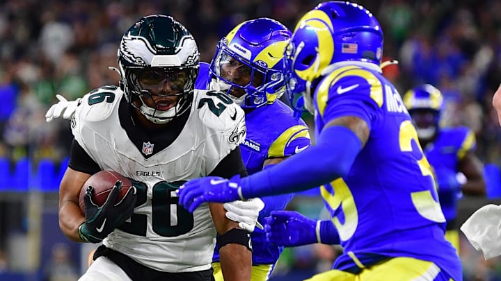 Nov 24, 2024; Inglewood, California, USA; Philadelphia Eagles running back Saquon Barkley (26) runs the ball against Los Angeles Rams safety Jaylen McCollough (39) during the second half at SoFi Stadium. Mandatory Credit: Gary A. Vasquez-Imagn Images Nov 24, 2024; Inglewood, California, USA; Philadelphia Eagles running back Saquon Barkley (26) runs the ball against Los Angeles Rams safety Jaylen McCollough (39) during the second half at SoFi Stadium. Mandatory Credit: Gary A. Vasquez-Imagn Images