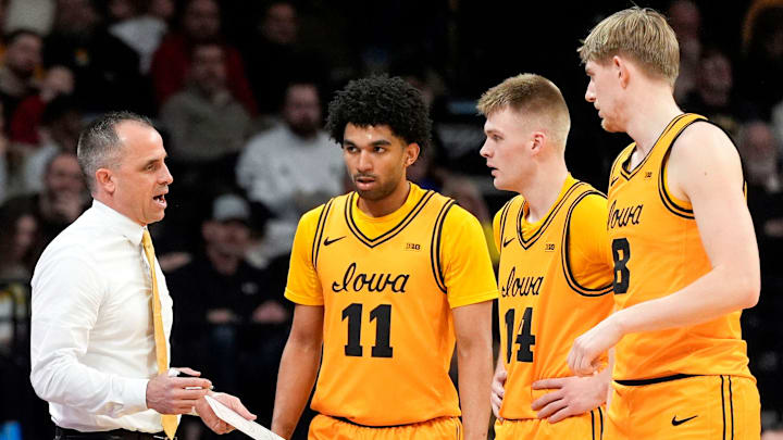 Iowa head coach Ben McCollum talks to Iowa guard Kael Combs (11), Iowa guard Bennett Stirtz (14) annd Iowa forward Cooper Koch (8) during a basketball game against the Northwestern Wildcats Feb. 8, 2026 at Carver-Hawkeye Arena in Iowa City, Iowa.