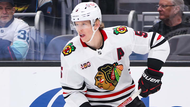 Nov 3, 2025; Seattle, Washington, USA; Chicago Blackhawks defenseman Connor Murphy (5) controls the puck in the second period against the Seattle Kraken at Climate Pledge Arena. Mandatory Credit: Kevin Ng-Imagn Images Nov 3, 2025; Seattle, Washington, USA; Chicago Blackhawks defenseman Connor Murphy (5) controls the puck in the second period against the Seattle Kraken at Climate Pledge Arena. Mandatory Credit: Kevin Ng-Imagn Images