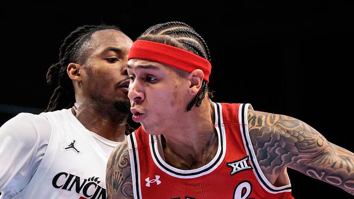 Mar 10, 2026; Kansas City, MO, USA; Utah Utes guard Terrence Brown (2) drives around Cincinnati Bearcats guard Day Day Thomas (1) during the second half at T-Mobile Center. Mandatory Credit: William Purnell-Imagn Images Mar 10, 2026; Kansas City, MO, USA; Utah Utes guard Terrence Brown (2) drives around Cincinnati Bearcats guard Day Day Thomas (1) during the second half at T-Mobile Center. Mandatory Credit: William Purnell-Imagn Images
