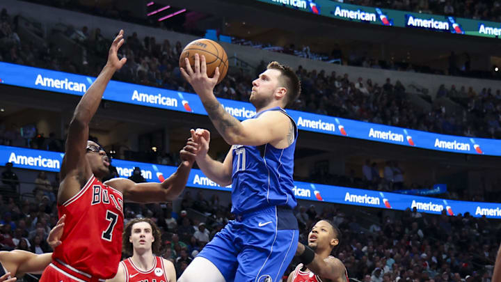 Nov 6, 2024; Dallas, Texas, USA; Dallas Mavericks guard Luka Doncic (77) shoots as Chicago Bulls forward Jalen Smith (7) defends during the second half at American Airlines Center. Mandatory Credit: Kevin Jairaj-Imagn Images