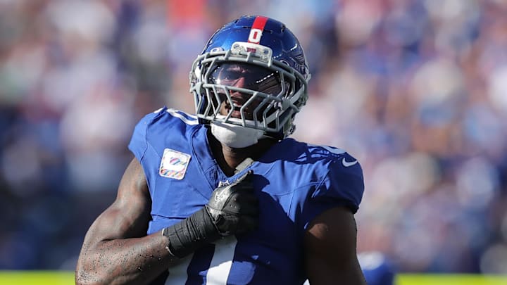 Sep 28, 2025; East Rutherford, New Jersey, USA; New York Giants linebacker Brian Burns (0) celebrates after sacking Los Angeles Chargers quarterback Justin Herbert (10) (not pictured) during the fourth quarter at MetLife Stadium.  