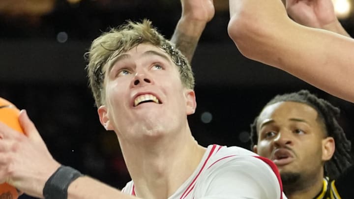 Apr 4, 2026; Indianapolis, IN, USA;  Arizona Wildcats center Motiejus Krivas (13) shoots against Michigan Wolverines center Aday Mara (15) in the second half during a semifinal of the Final Four of the men's 2026 NCAA Tournament at Lucas Oil Stadium. Mandatory Credit: Robert Deutsch-Imagn Images