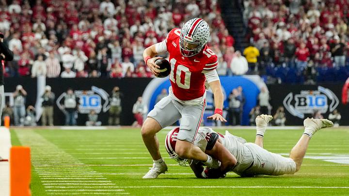 Indiana Hoosiers linebacker Isaiah Jones (46) works to bring down Ohio State Buckeyes quarterback Julian Sayin (10) on Saturday, Dec. 6, 2025, during the Big Ten football championship at Lucas Oil Stadium in Indianapolis. Indiana Hoosiers linebacker Isaiah Jones (46) works to bring down Ohio State Buckeyes quarterback Julian Sayin (10) on Saturday, Dec. 6, 2025, during the Big Ten football championship at Lucas Oil Stadium in Indianapolis.