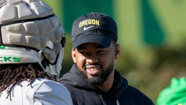 New Oregon running backs coach Ra’Shaad Samples talks with running back Jordan James during practice with the Oregon Ducks Tuesday, April 9, 2024, at the Hatfield-Dowlin Complex in Eugene, Ore.